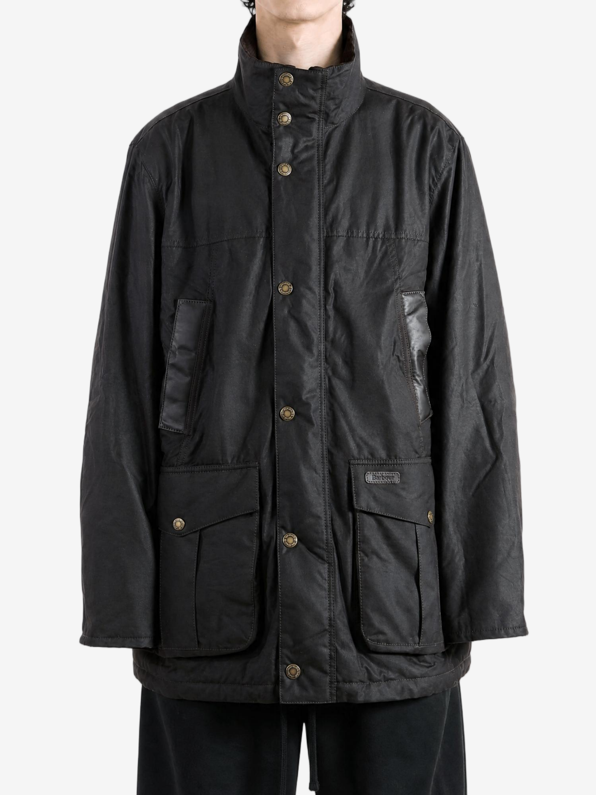 Black jacket worn by a person, showing the jacket fit