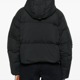 Black jacket worn by a person, showing the jacket fit