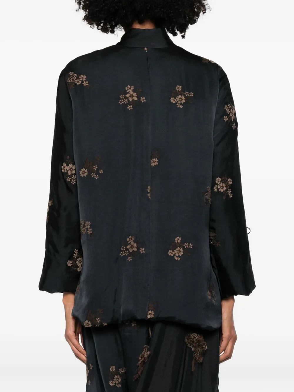 Black jackets worn by a person, showing the jackets fit