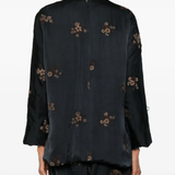 Black jackets worn by a person, showing the jackets fit