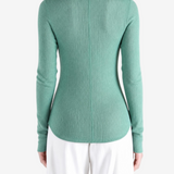 Green top, full body view