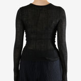 Black topworn by a person, showing the top fit