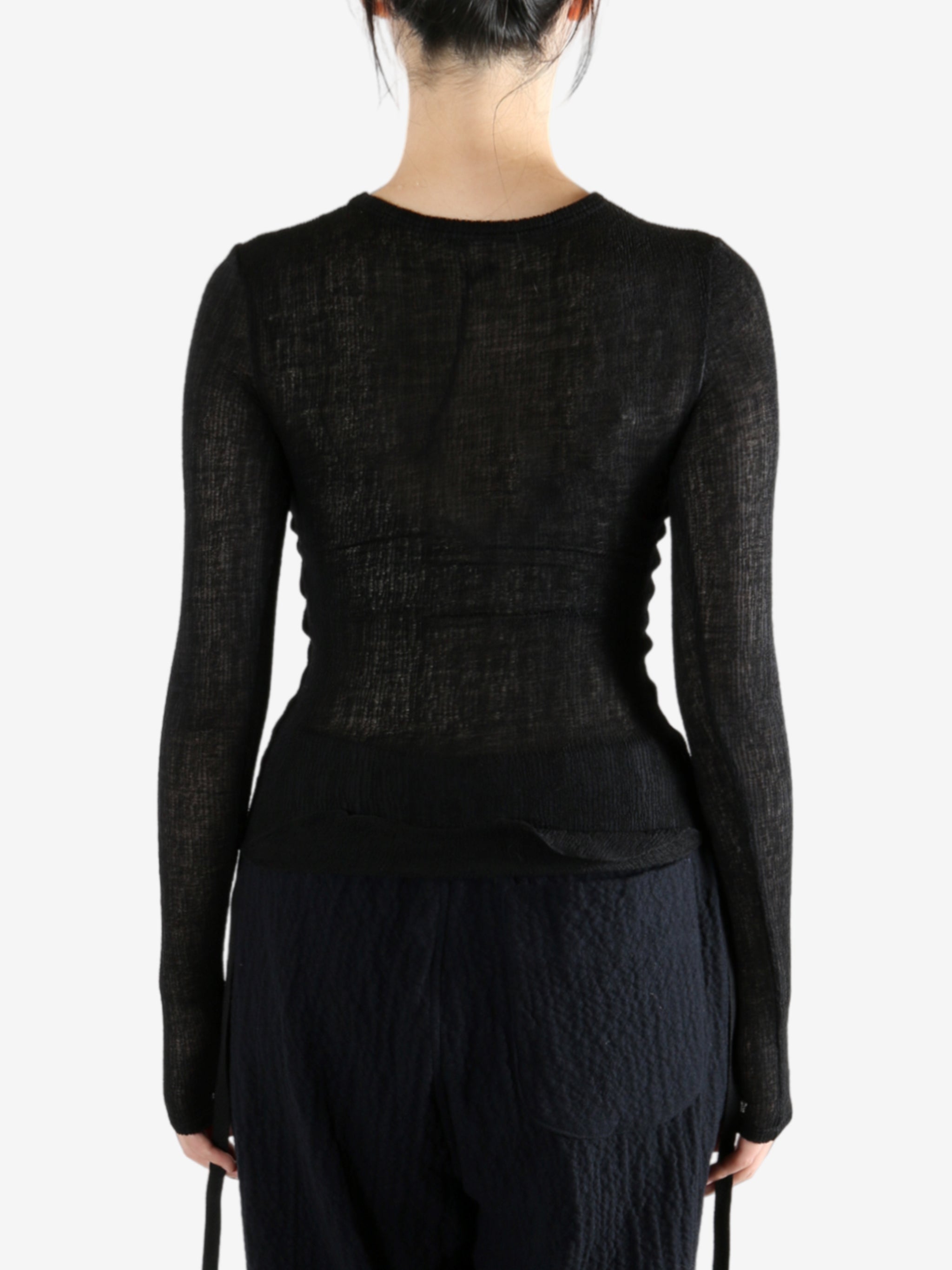 Black topworn by a person, showing the top fit