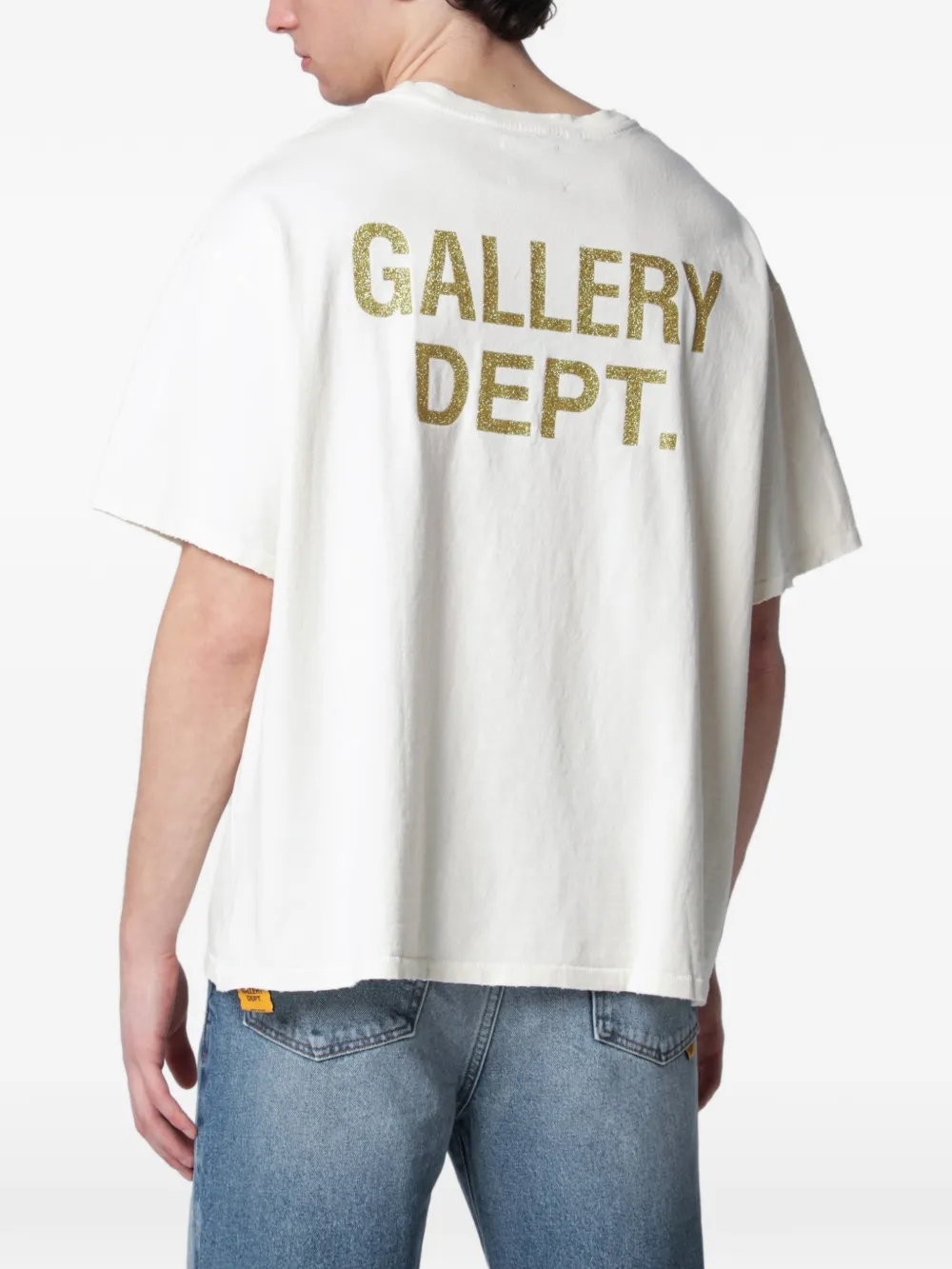 White t-shirt worn by a person, showing the t-shirt fit