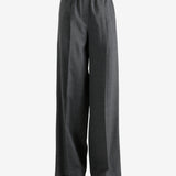 Grey pants worn by a person, showing the pants fit