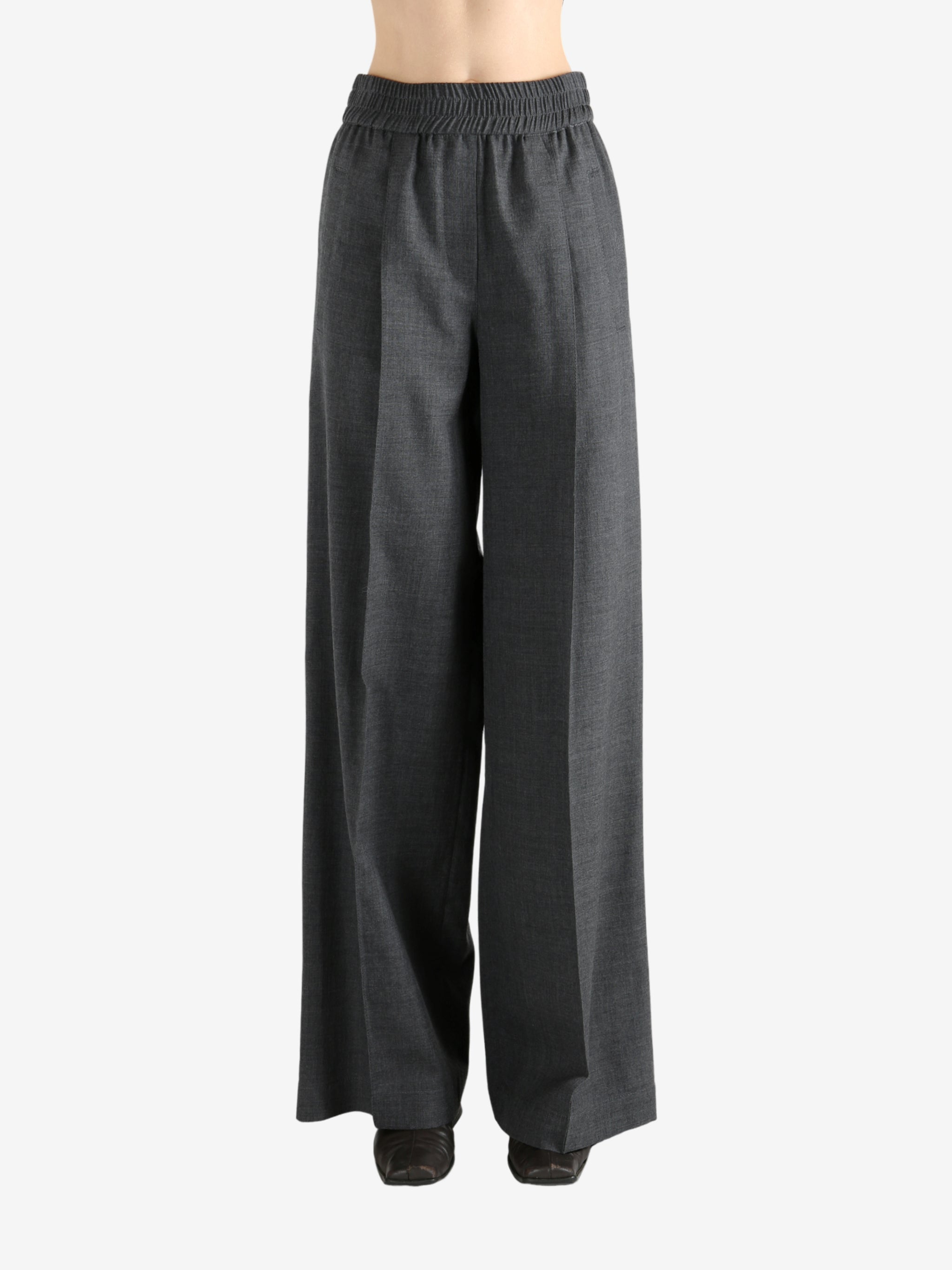 Grey pants worn by a person, showing the pants fit