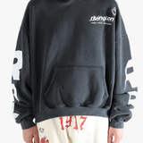 Black hoodie worn by a person, showing the hoodie fit