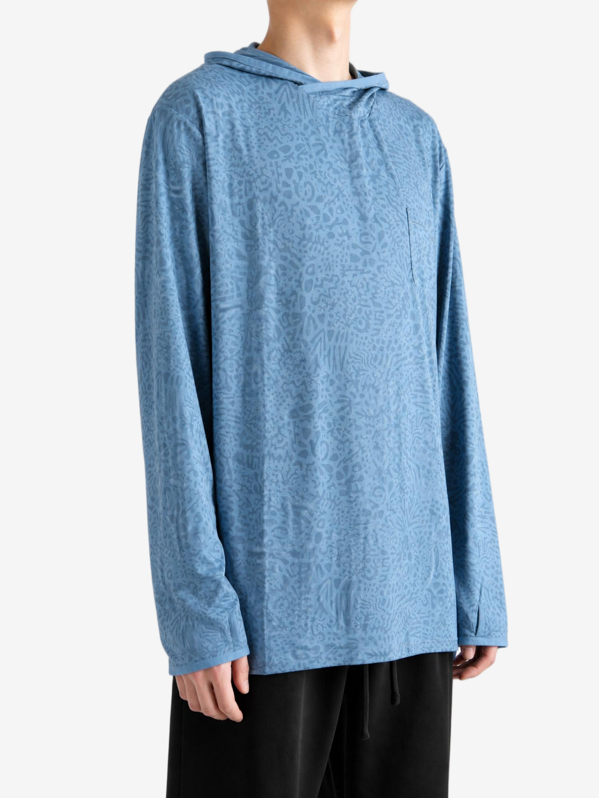 Blue hoodie worn by a person, showing the hoodie fit
