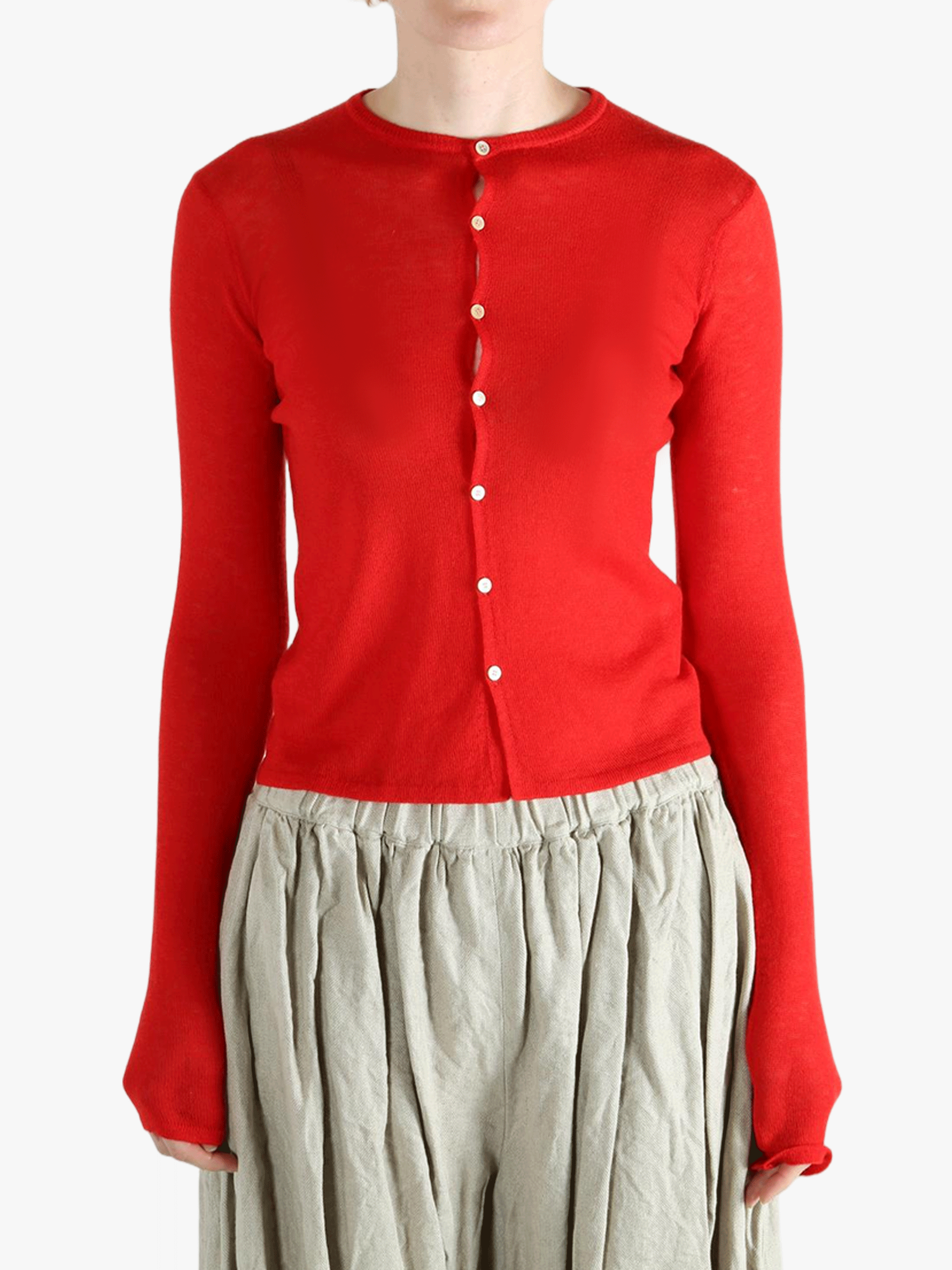 Red knitwear worn by a person, showing the knitwear's fit