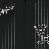 Close up of black t-shirt, showing texture of the polyester fabric