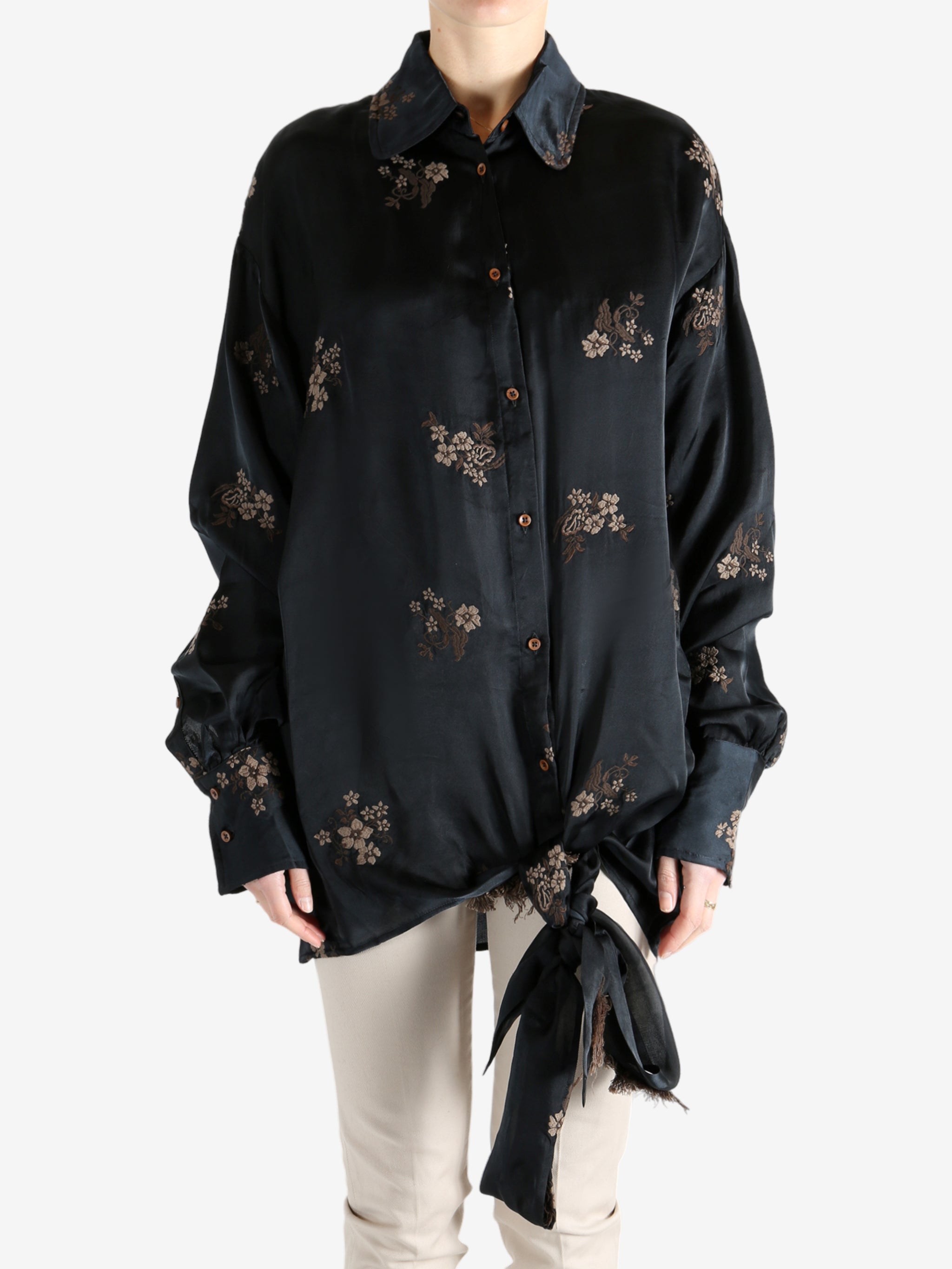 Black top worn by a person, showing the top's fit