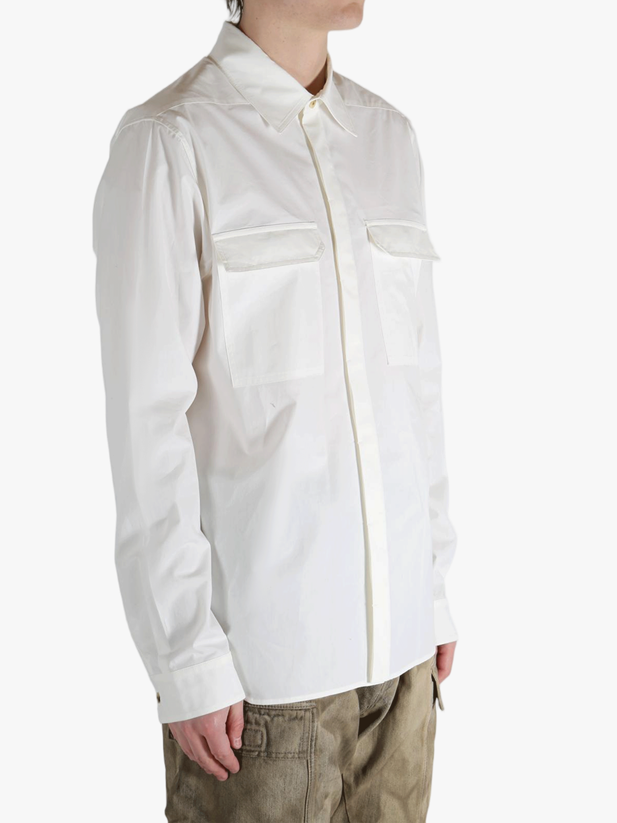 White shirt worn by a person, showing the shirt's fit