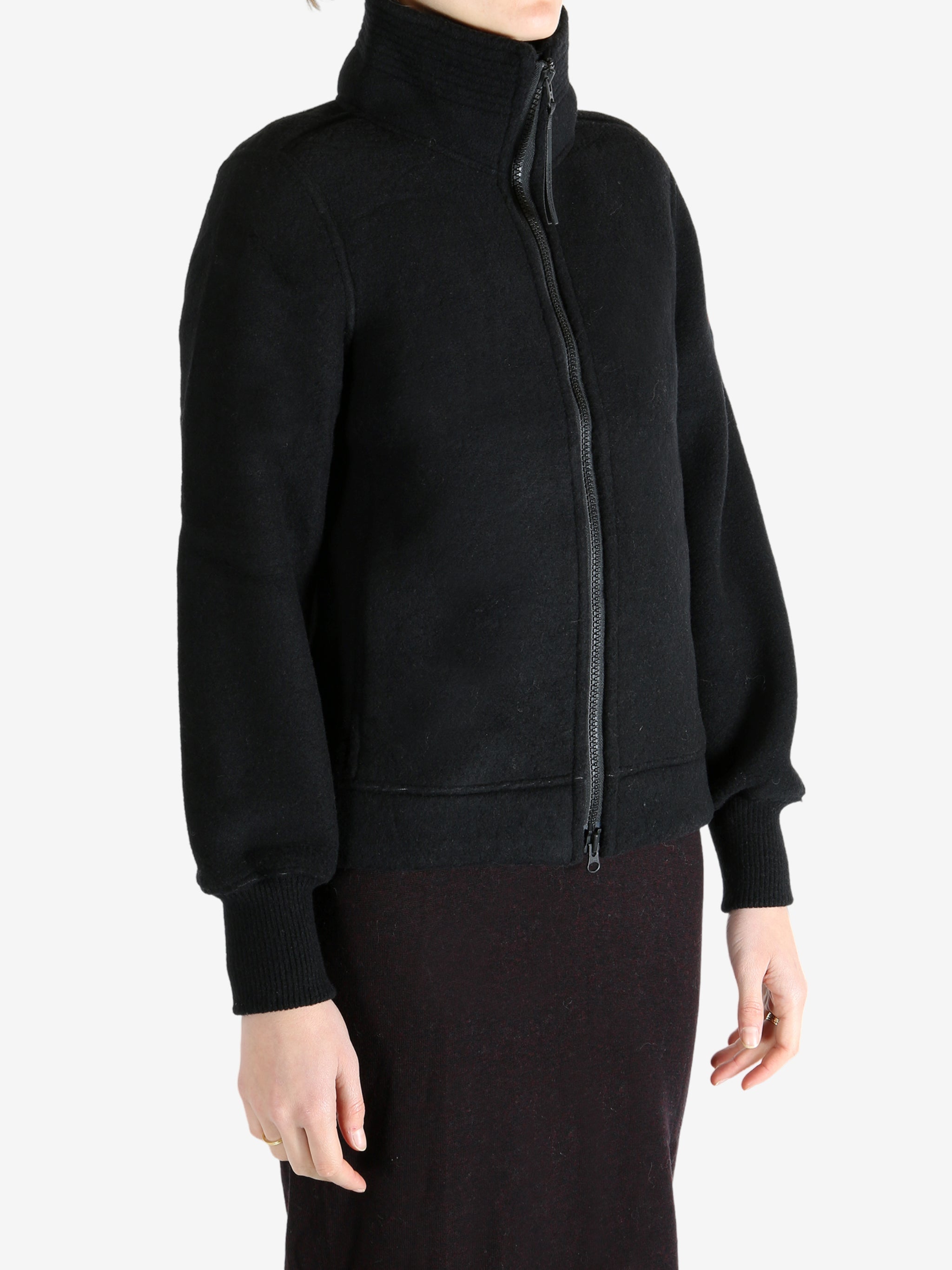 Black jacket worn by a person, showing the jacket fit