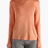 Orange shirts worn by a person, showing the  shirt's  fit