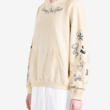 Tan hoodie worn by a person, showing the hoodie fit