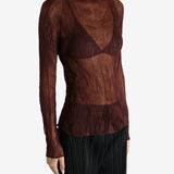 Brown shirt worn by a person, showing the shirt's fit