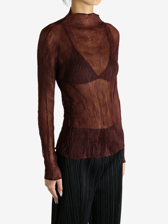 Brown shirt worn by a person, showing the shirt's fit