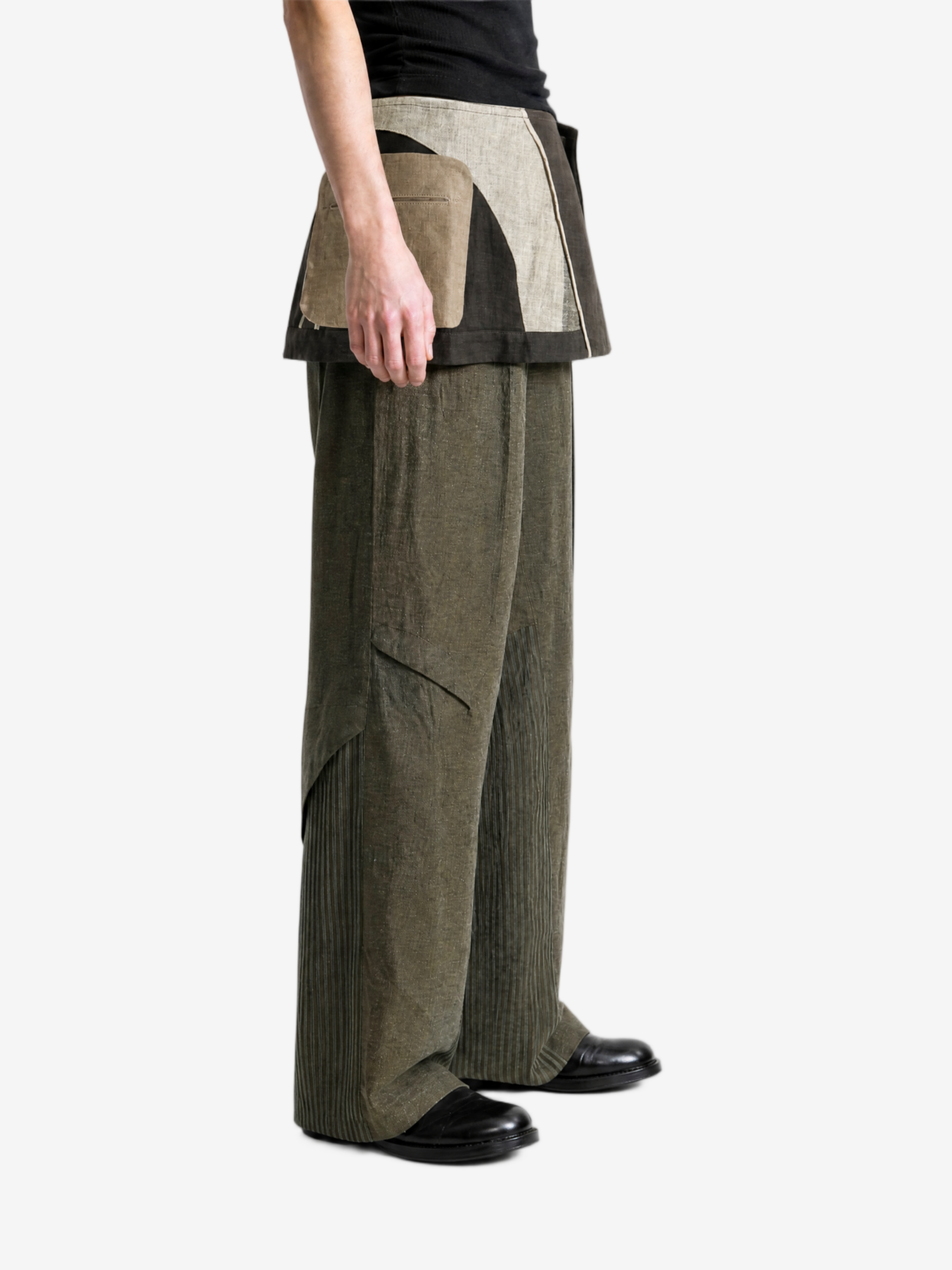 Green pants worn by a person, showing the pants fit