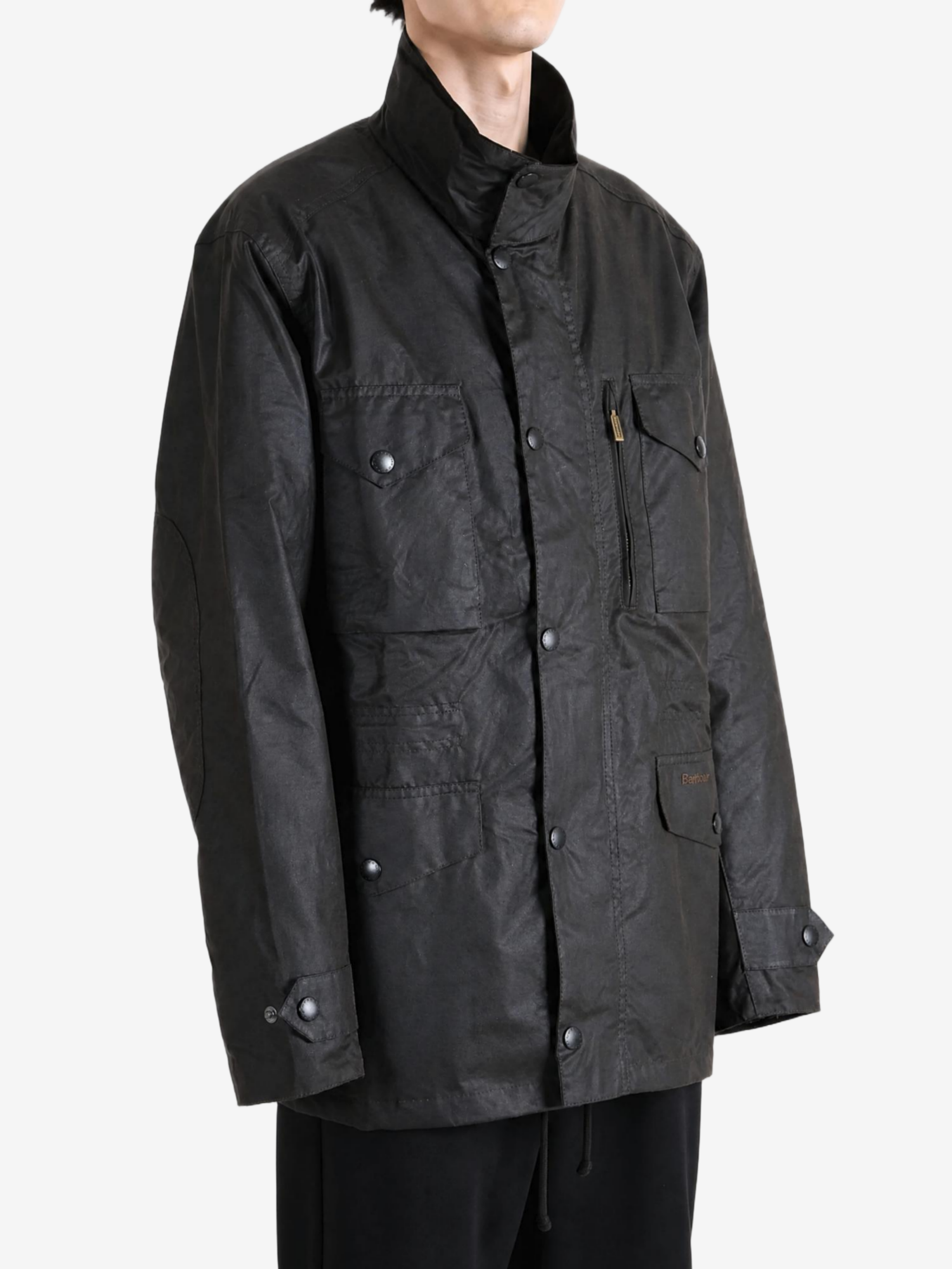Black jacket worn by a person, showing the jacket fit