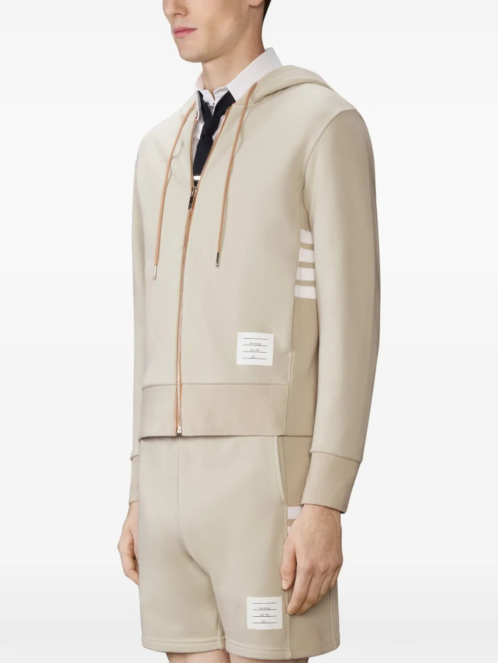 Tan hoodies worn by a person, showing the hoodies fit