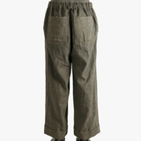 Green pants worn by a person, showing the pants' fit