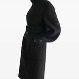 Black jacket worn by a person, showing the jacket fit