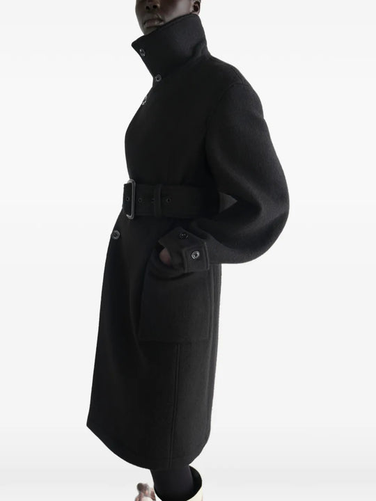 Black jacket worn by a person, showing the jacket fit
