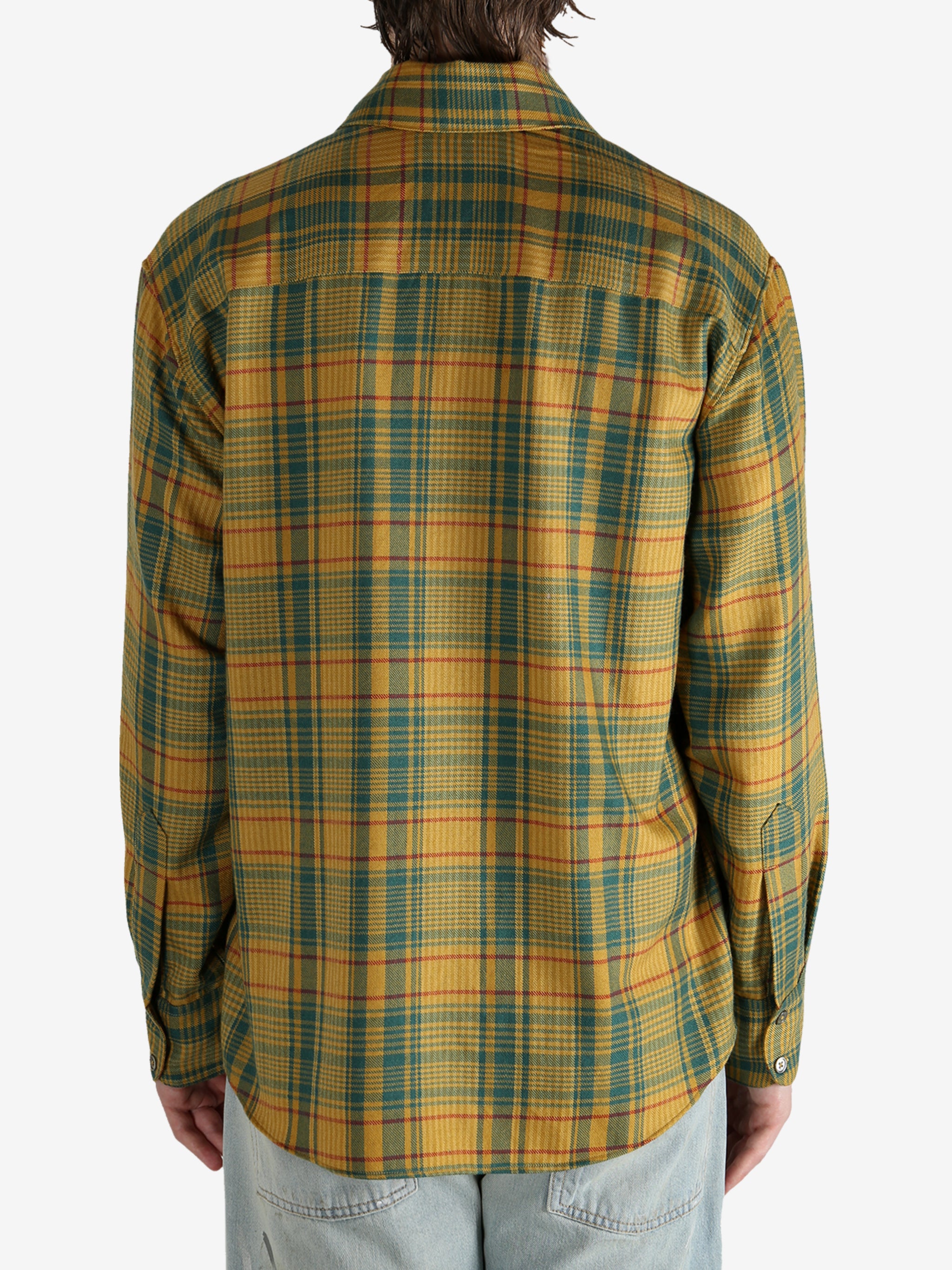 Yellow shirt worn by a person, showing the shirt’s fit