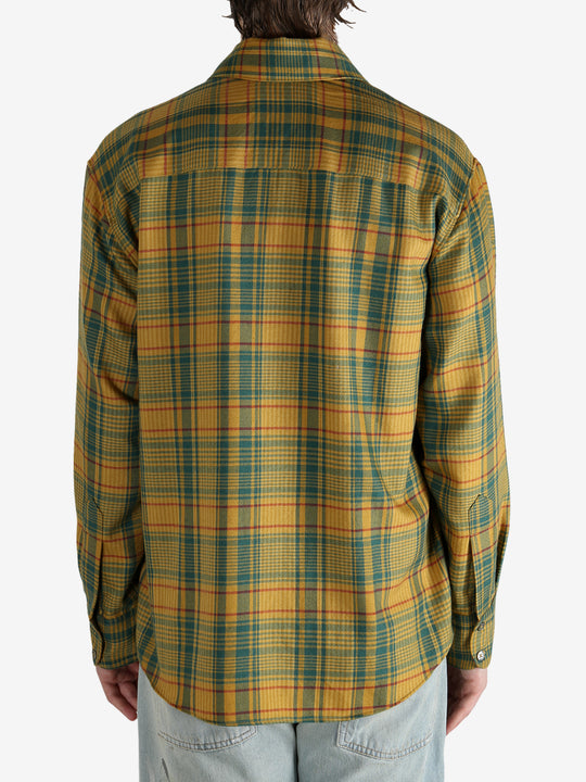 Yellow shirt worn by a person, showing the shirt’s fit