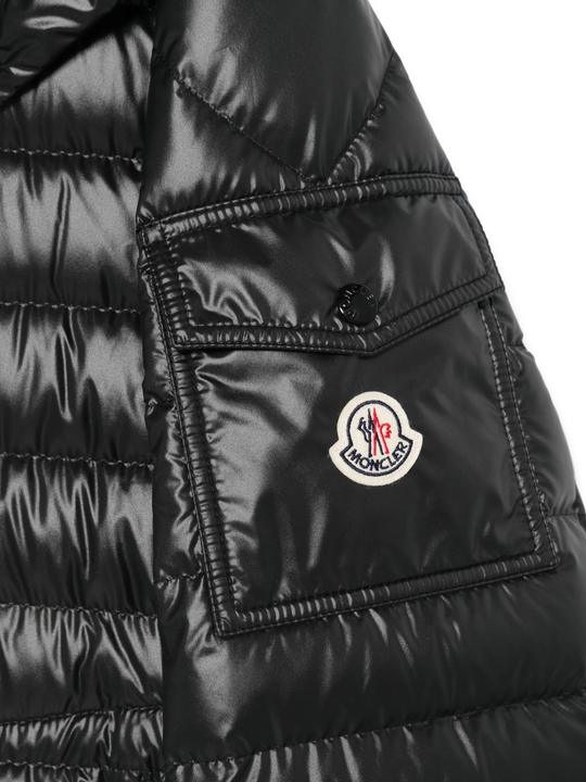 Close up of black jacket, showing texture of the Polyester fabric