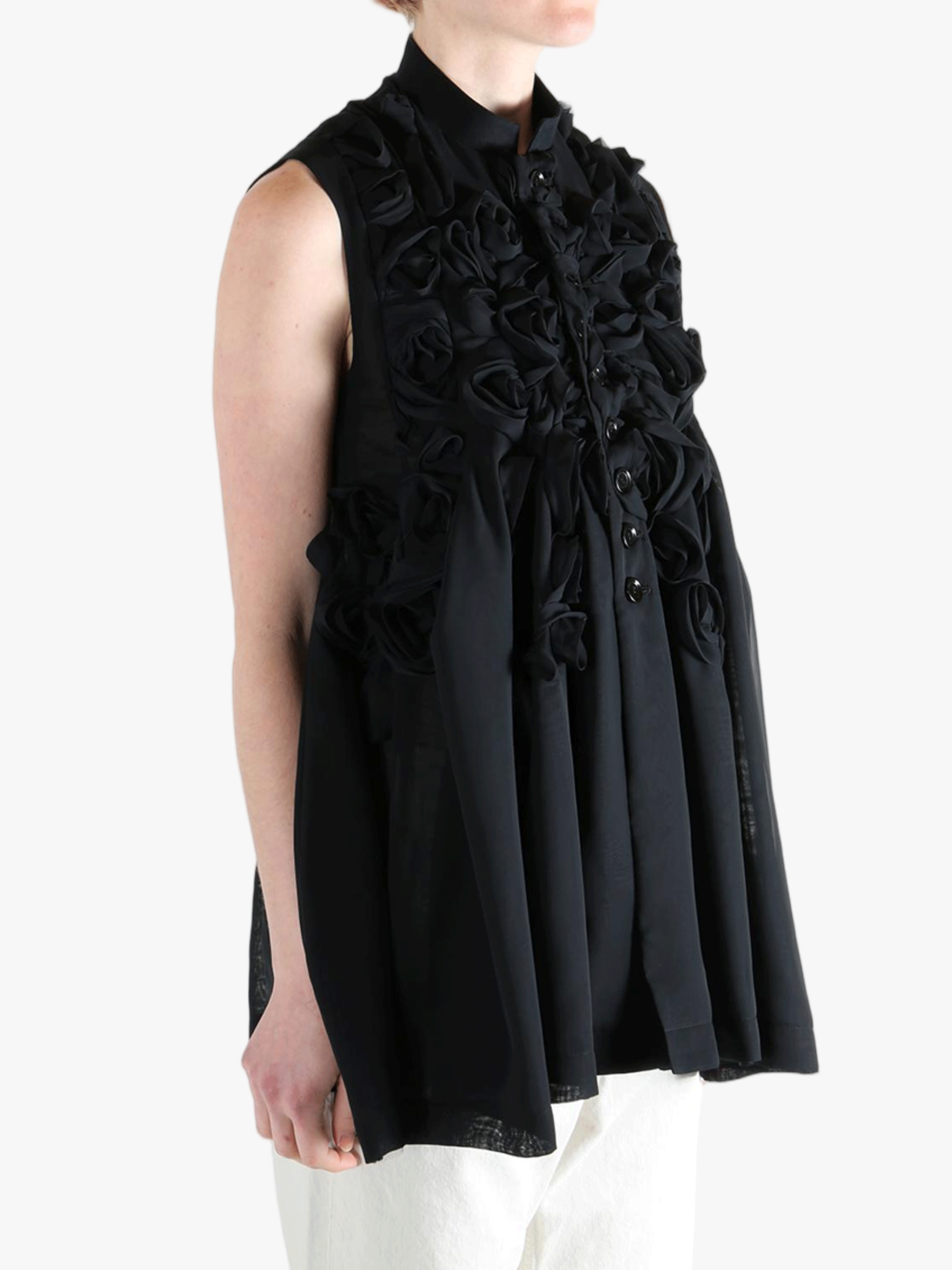 Black vest worn by a person, showing the vest's fit