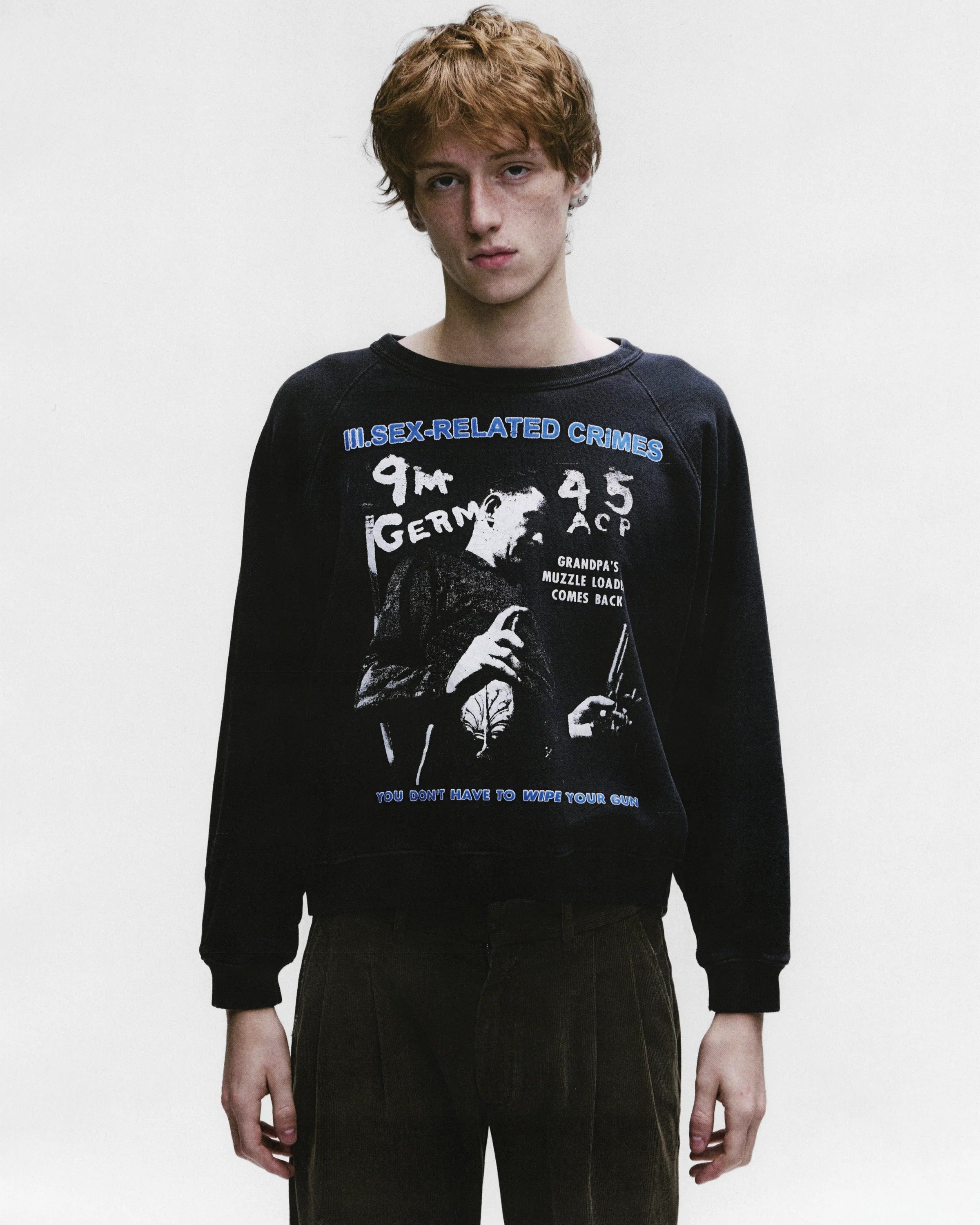 Black sweatshirt worn by a person, showing the sweatshirt's fit