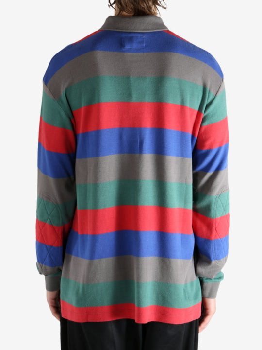 Grey shirt worn by a person, showing the shirt's fit