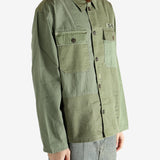 Green shirt worn by a person, showing the shirt's fit