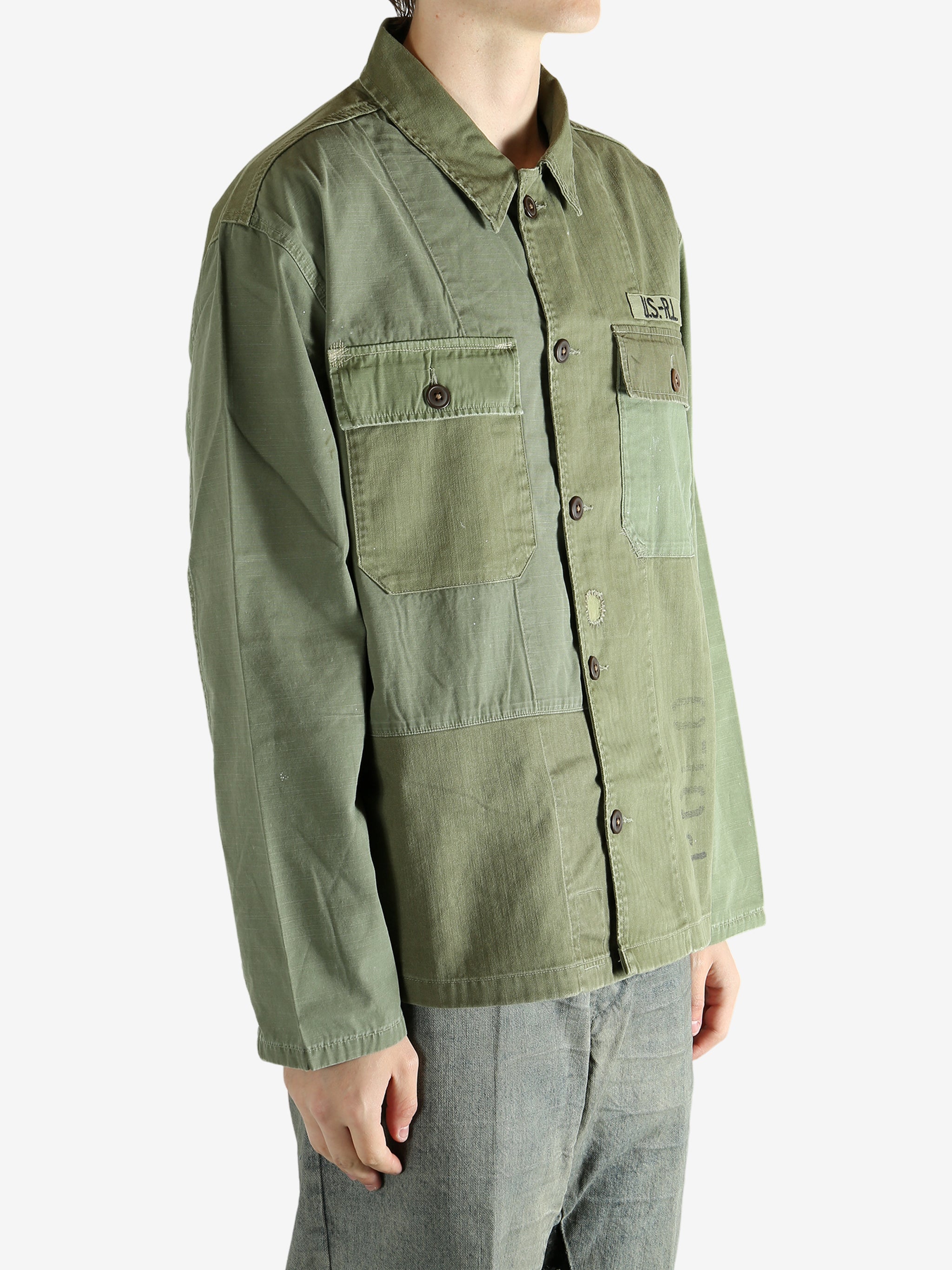 Green shirt worn by a person, showing the shirt's fit