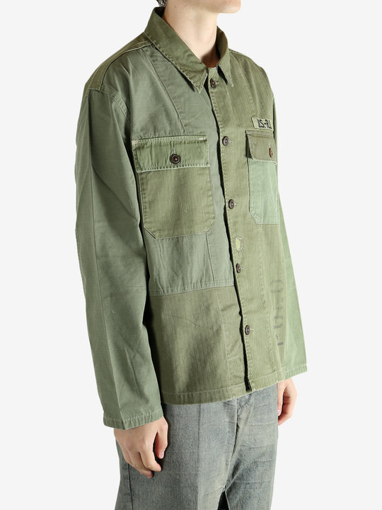 Green shirt worn by a person, showing the shirt's fit