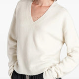 White top worn by a person, showing the top fit