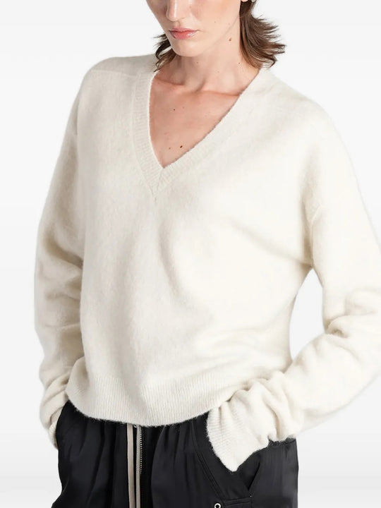 White top worn by a person, showing the top fit