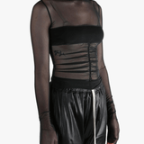 Black top worn by a person, showing the top's fit