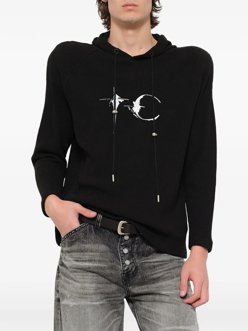 Black hoodie worn by a person, showing the hoodie fit