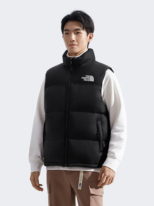 Black vest worn by a person, showing the vest's fit