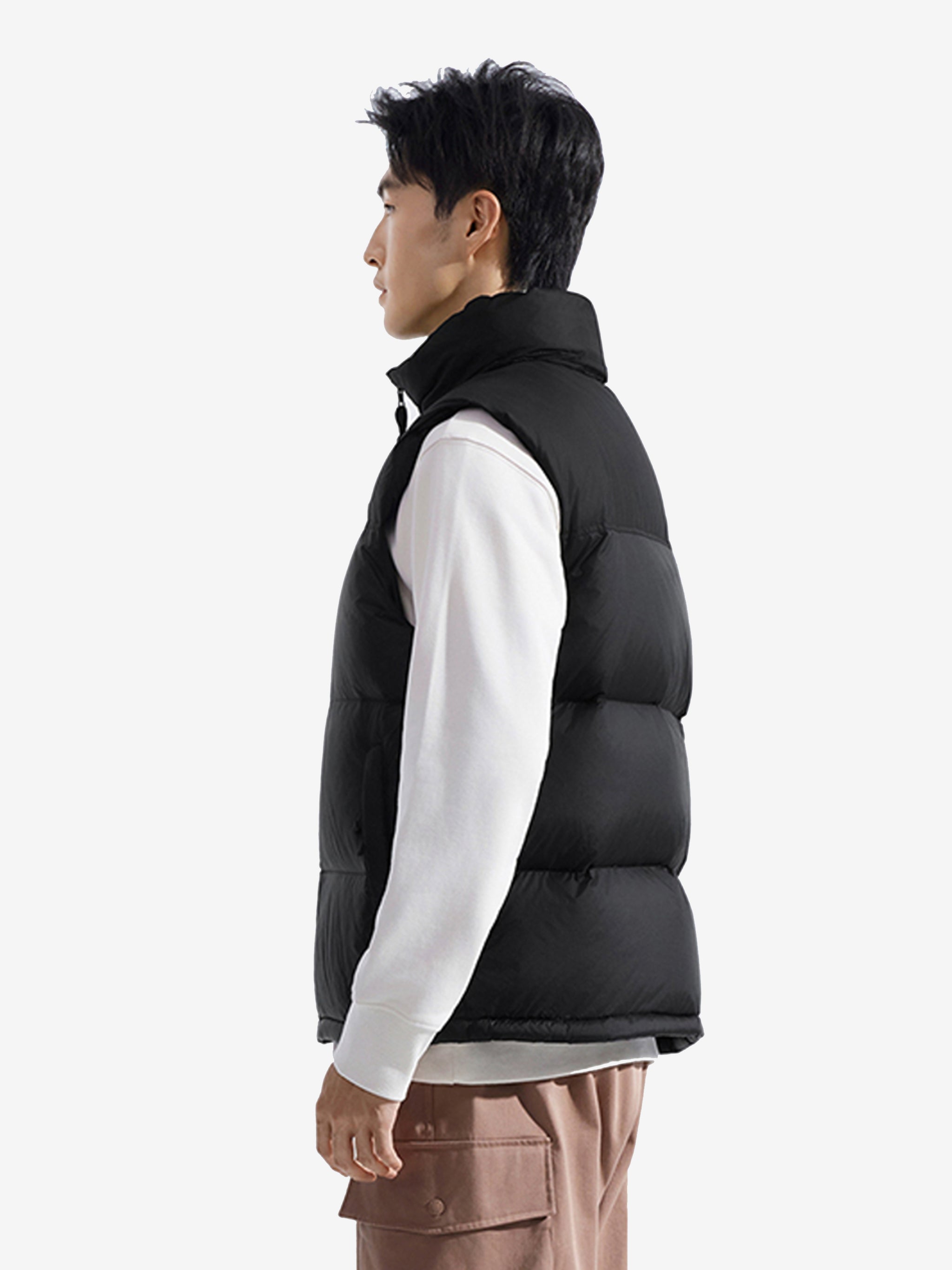 Black vest worn by a person, showing the vest's fit
