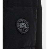 Close up of the black vest, showing texture of the polyester fabric