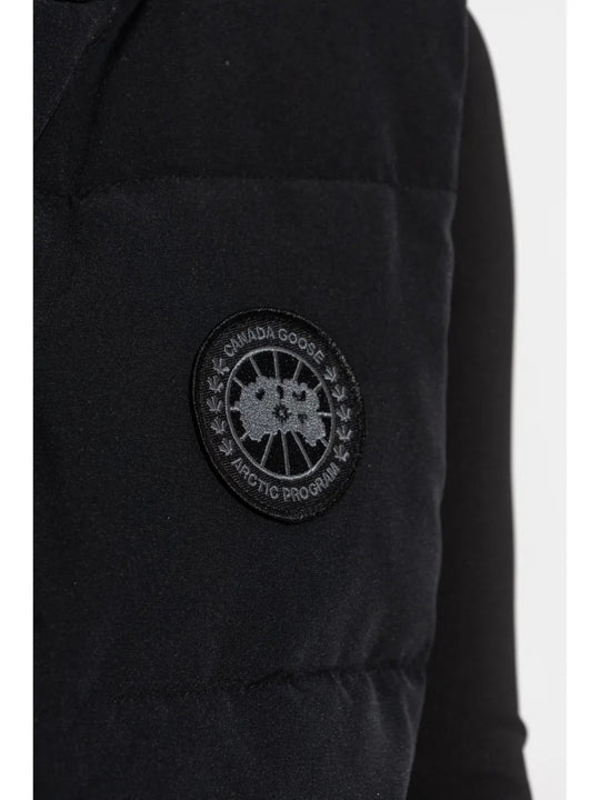 Close up of the black vest, showing texture of the polyester fabric