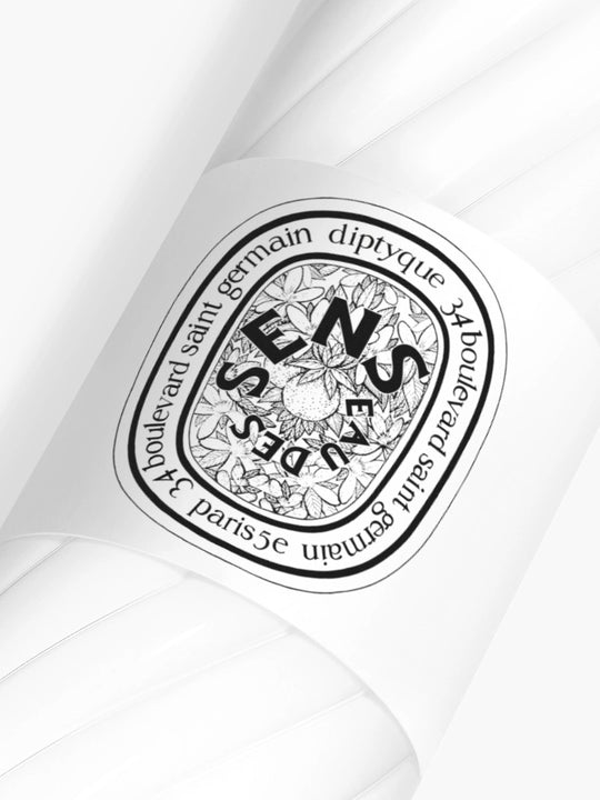 Diptyque perfume bottle cap with brand logo on a white background