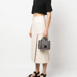 Black bag worn by a person, showing the bag's fit