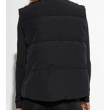 Black vest worn by a person, showing the vest's fit