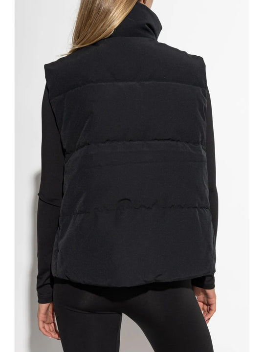 Black vest worn by a person, showing the vest's fit