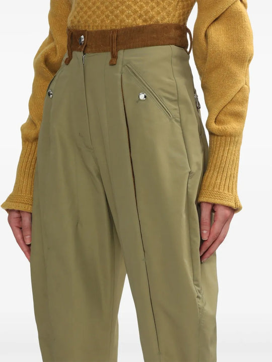 Close-up of green pants, showing texture of the fabric