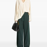 Green pants, full body view